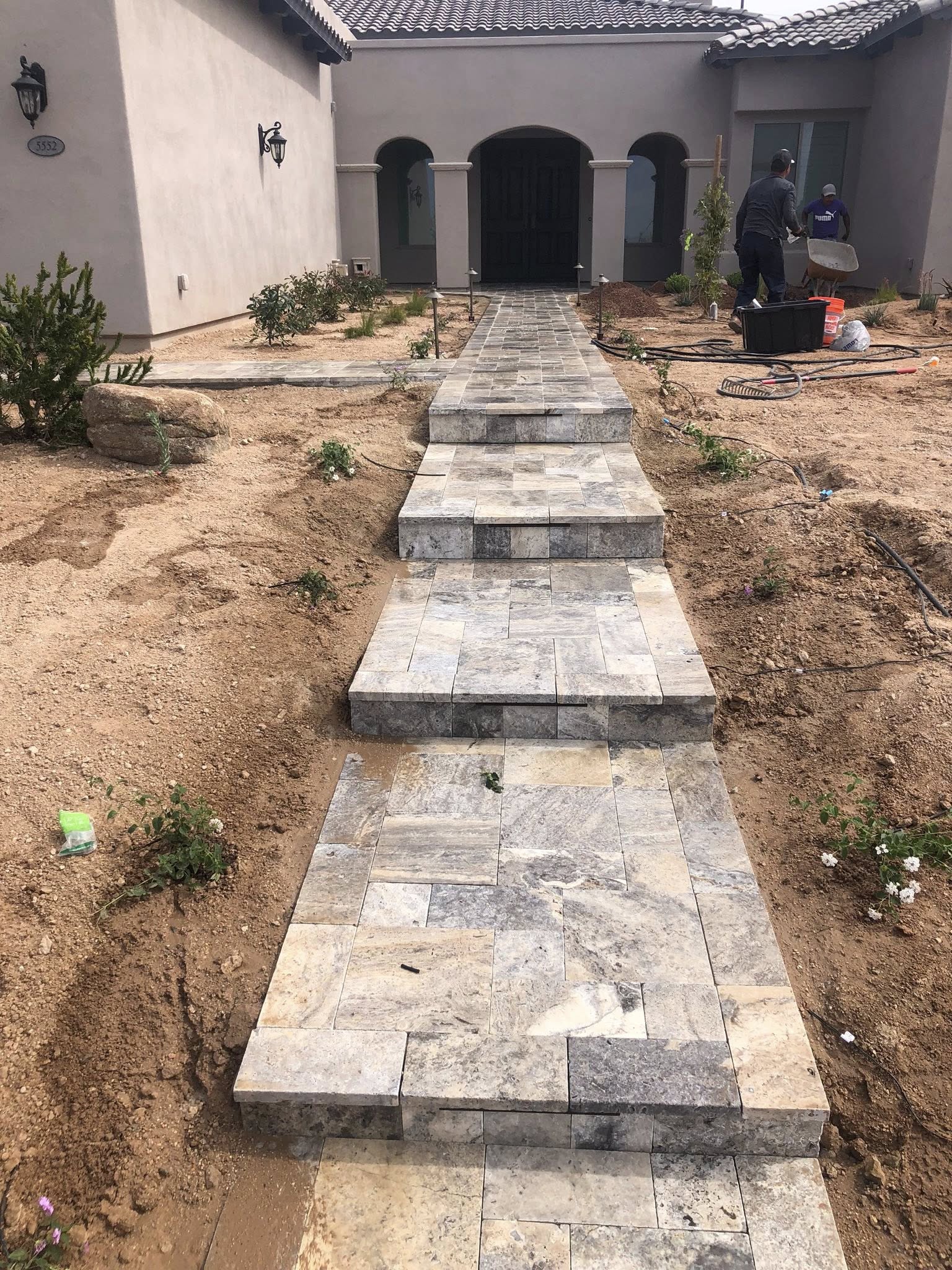Front walkway with travertine pavers