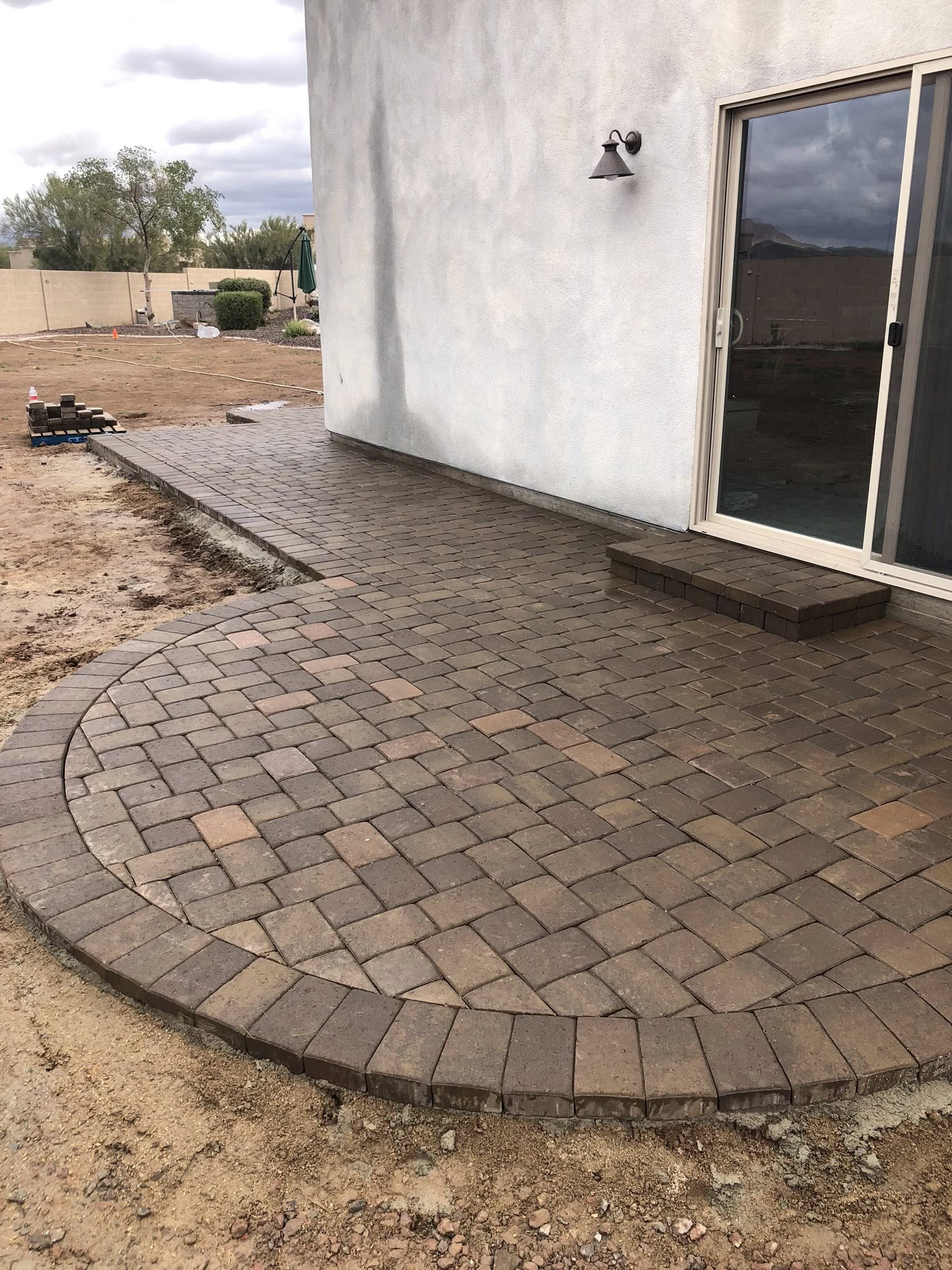 Modern pool deck with acid-stained concrete